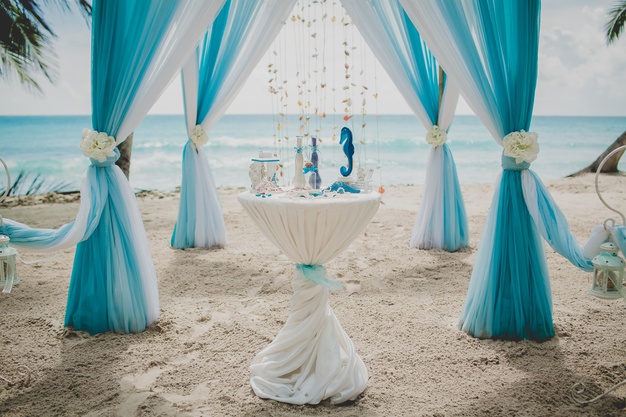 blue white wedding aisle beach surrounded